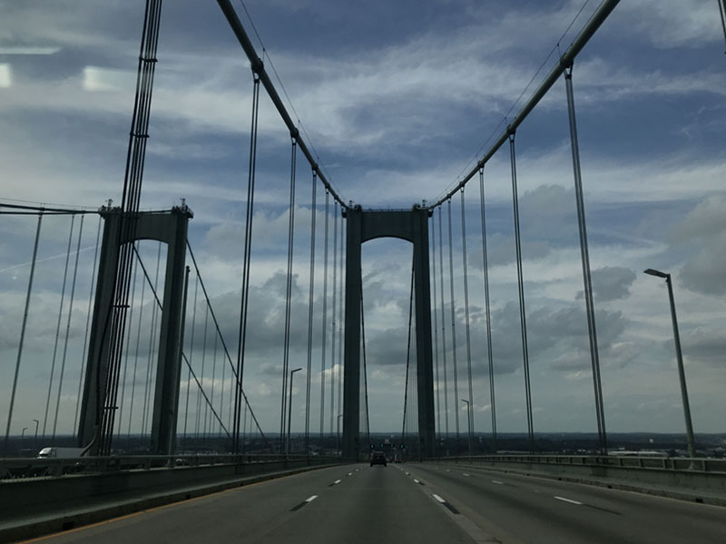 Paired Suspension Bridges from the Roadway with Big Sky.